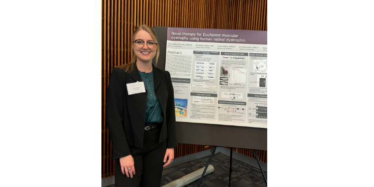 Jessica Bennet stands in front of her poster at OHD. 